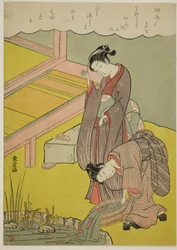 Junges Mädchen wirft Fisch in den Teich