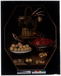 Stillleben mit Granatäpfeln und Trauben in einem Korb