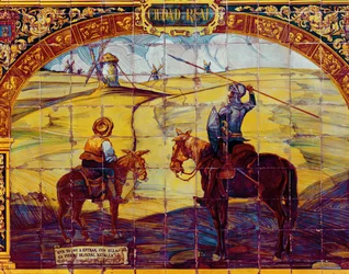 Fliesen, die Don Quijote und Sancho Panza zeigen, wie sie sich darauf vorbereiten, die Windmühlen anzugreifen (Keramik)
