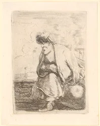 Alter Türke mit Mantel und Turban sitzt auf einem Stein