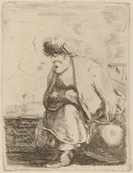 Ein alter Türke mit Turban, auf einem Felsen sitzend