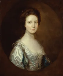 Elizabeth Parry in einem weißen Kleid und blauen geschlitzten Ärmeln