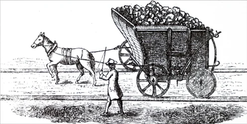 Ein Pferd zieht einen Kohlenwagen
