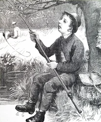 Ein Junge beim Angeln