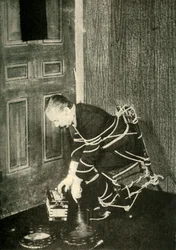 John Nevil Maskelyne führt eine Geisterkabinett-Illusion vor, um 1910
