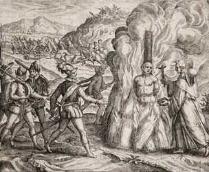 Beschreibung der Verbrechen an den Indianern durch die spanischen Kolonisten - Konquistadoren verbrennen einen Indianer, der sich weigerte, zum katholischen Glauben zu konvertieren. Religiöse des Franziskanerordens (Gravur) "Narratio regionum indicarum per