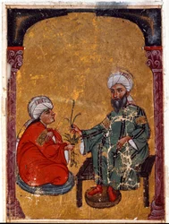 Der Arzt und Botaniker Pedanius Dioscorides (40-90 n. Chr.) erklärt einem seiner Schüler die Tugenden von Pflanzen, abgeleitet aus seinem Traktat „De materia medica“ (Fol. 2 verso). Aus dem Irak. 1229 Topkapi Sarayi Museum Bibliothek, Istanbul