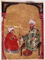 Der Arzt und Botaniker Pedanius Dioscorides (40-90 n. Chr.) sitzt mit einem seiner Schüler. Miniatur aus seinem Traktat „De materia medica“ (ms Ahmed III, 2147, Folio 217a) 1229. Topkapi Sarayi Museum Bibliothek, Istanbul