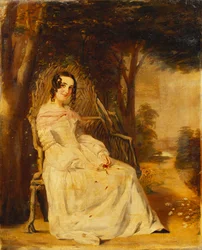 Porträt von Mary Freer, sitzend, klein, in voller Länge auf einem Gartensitz